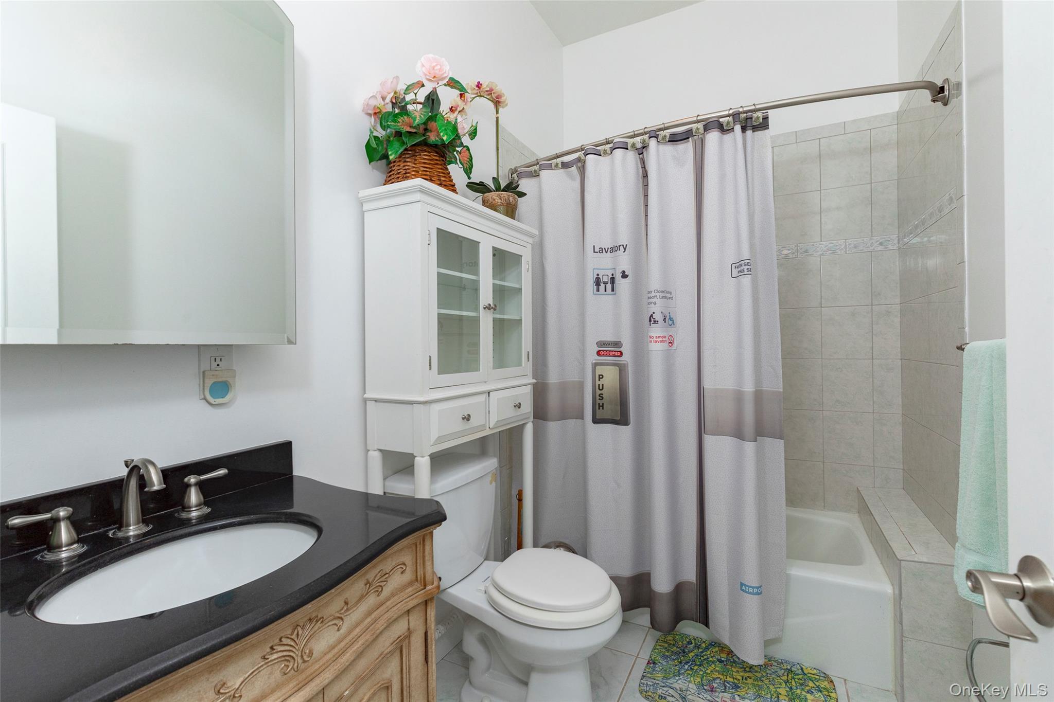 126 Old Hopewell Road Wappingers Falls, NY 12590 - Photo 26 of 38 a bathroom with a granite countertop sink toilet a mirror a vanity and shower