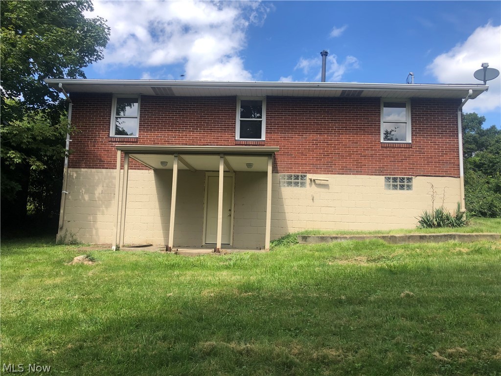 182 Culler Road Weirton, WV 26062 - Photo 23 of 23 Back of house featuring a lawn