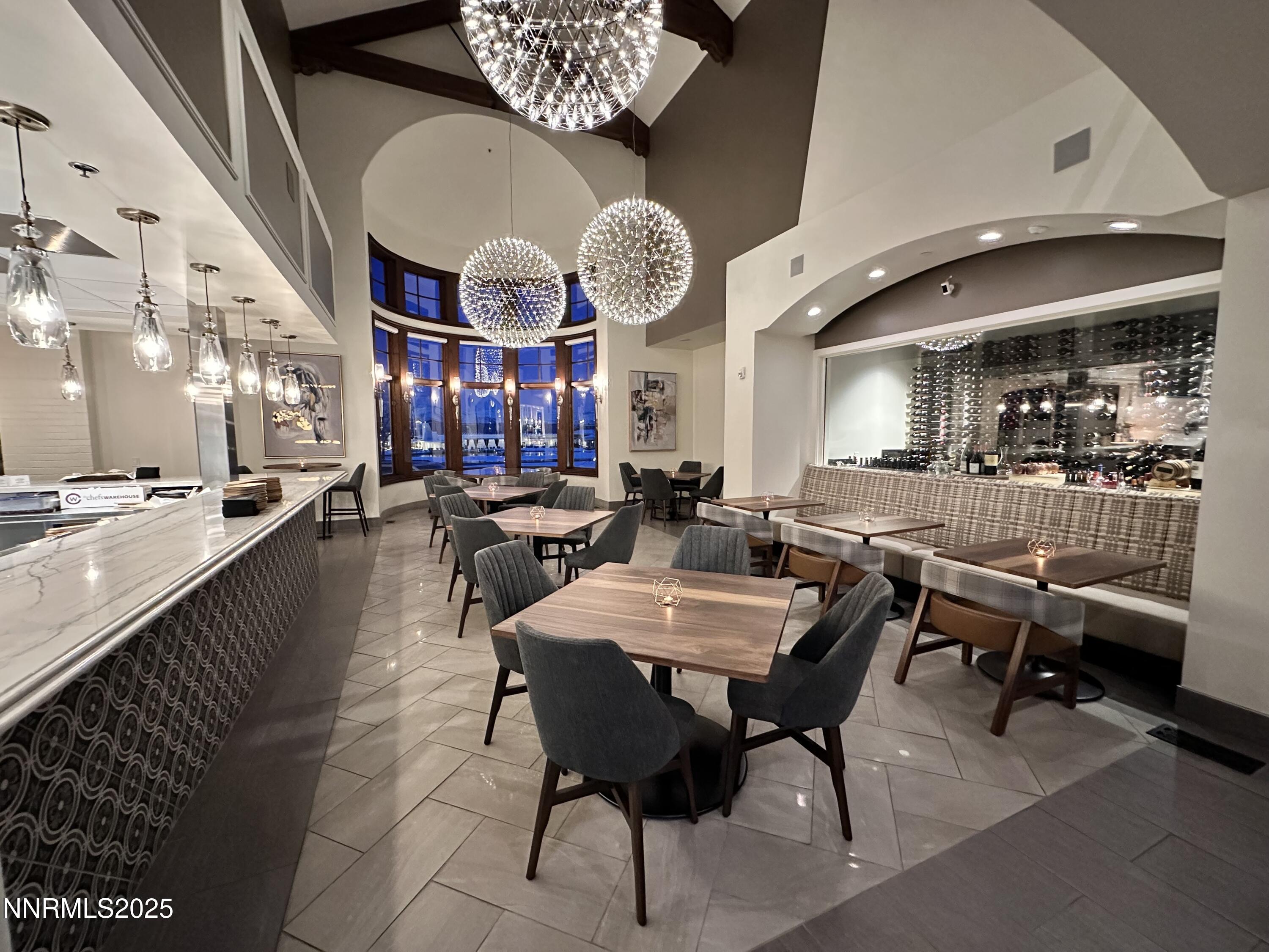 77 Caballada Street Reno, NV 89511 - Photo 49 of 55 a view of a dining area with furniture and a large window