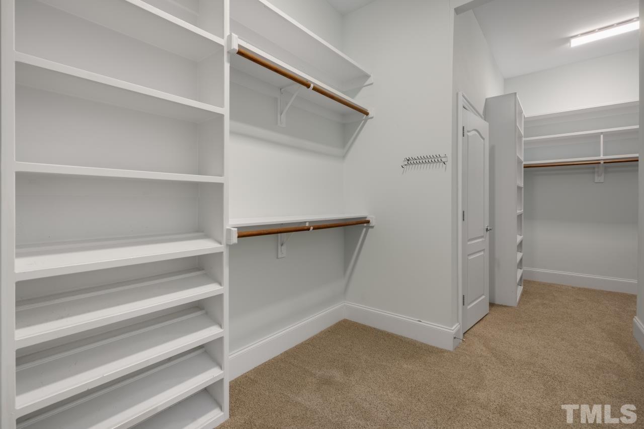 5909 Greenevers Drive Raleigh, NC 27613 - Photo 17 of 30 a view of an empty walk in closet