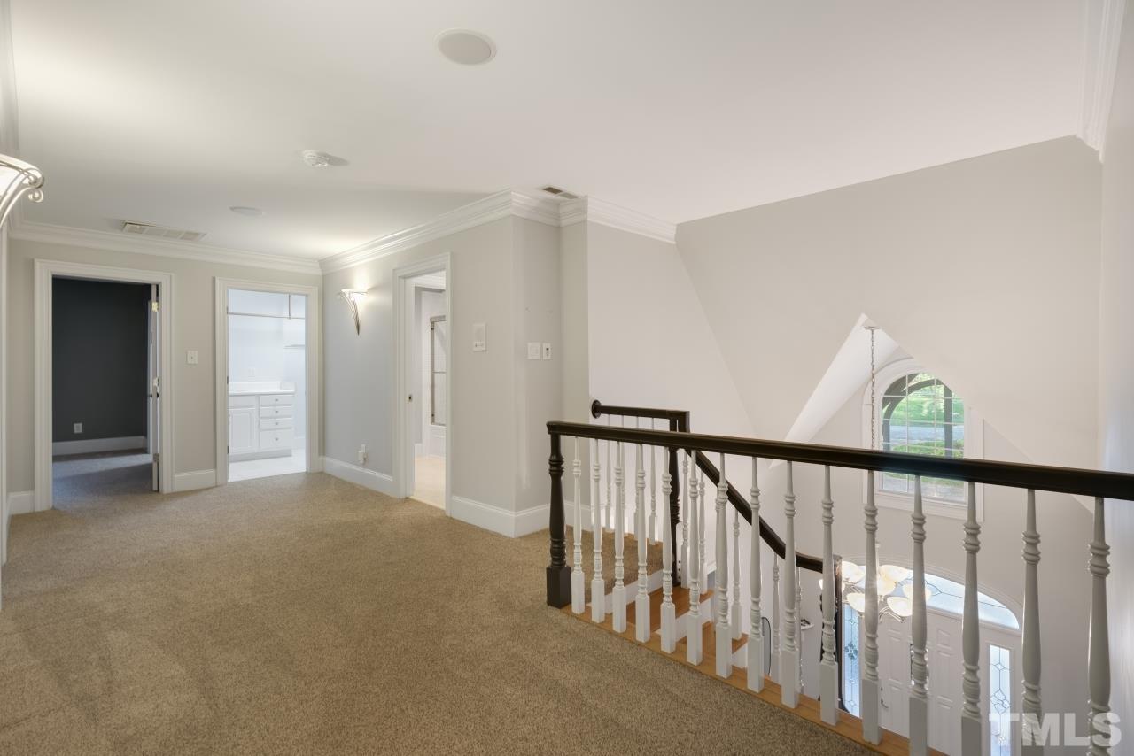 5909 Greenevers Drive Raleigh, NC 27613 - Photo 18 of 30 a view of a hallway with closet