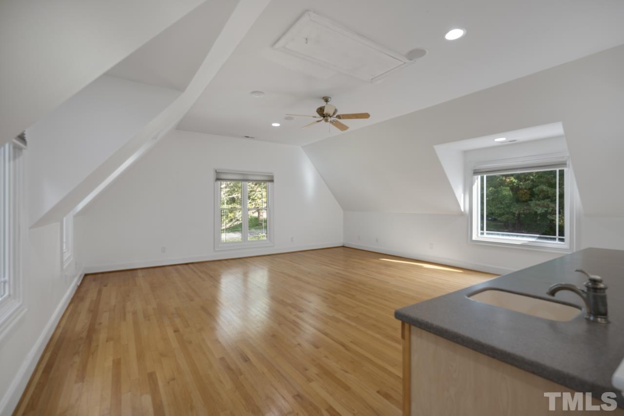 5909 Greenevers Drive Raleigh, NC 27613 - Photo 24 of 30 wooden floor in an empty room with a window