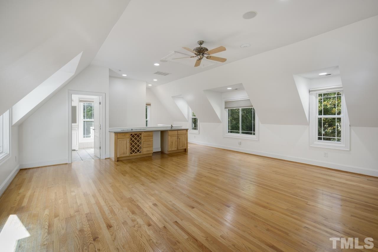 5909 Greenevers Drive Raleigh, NC 27613 - Photo 25 of 30 a view of an empty room with wooden floor and a window