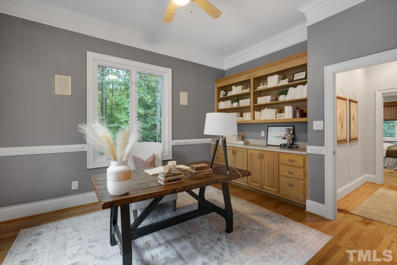 5909 Greenevers Drive Raleigh, NC 27613 - Photo 4 of 30 a view of a workspace with furniture and a window