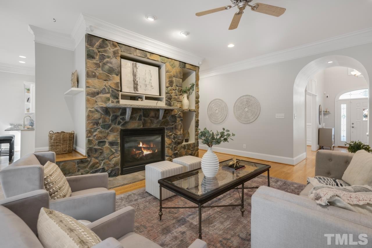 5909 Greenevers Drive Raleigh, NC 27613 - Photo 10 of 30 a living room with furniture and a fireplace