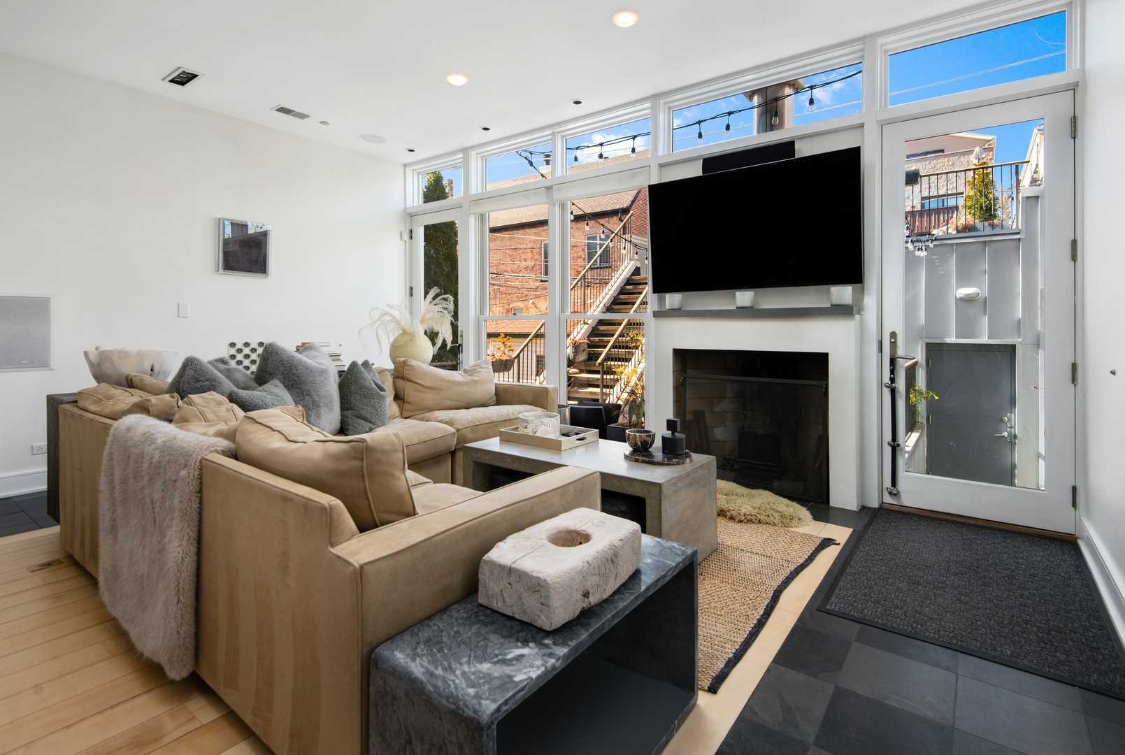 1708 North Mohawk Street Chicago, IL 60614 - Photo 7 of 33 a living room with furniture a fireplace and a flat screen tv