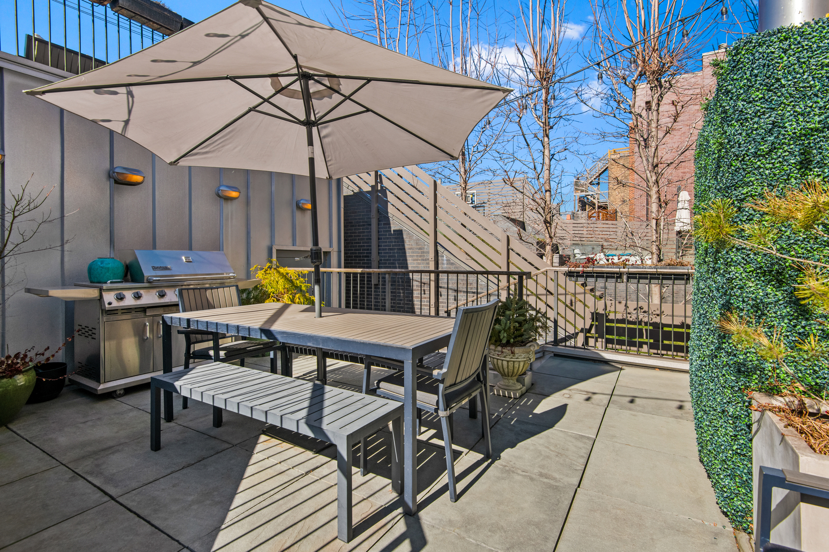 1708 North Mohawk Street Chicago, IL 60614 - Photo 8 of 33 a view of a patio with a table and chairs under an umbrella