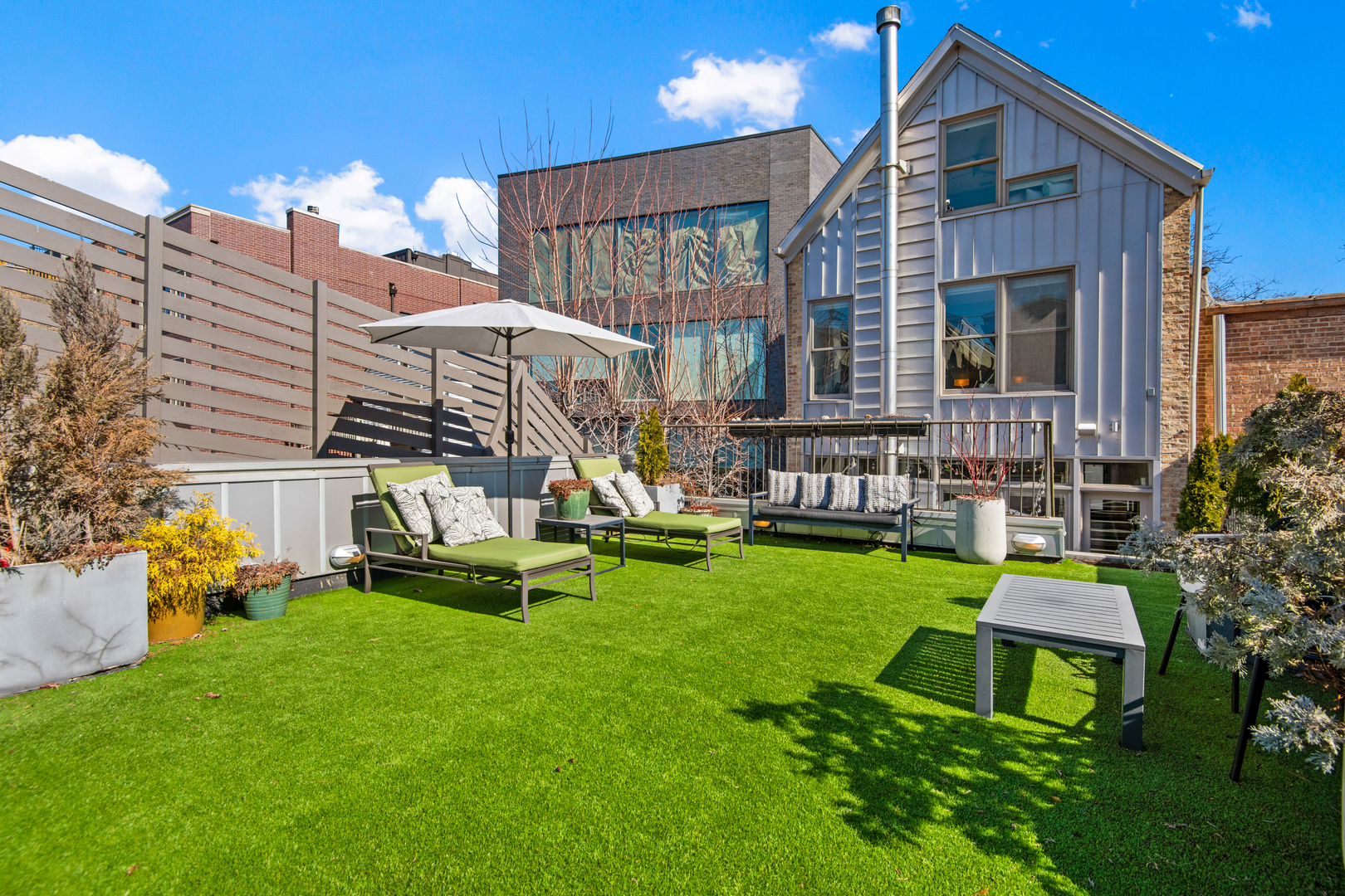 1708 North Mohawk Street Chicago, IL 60614 - Photo 9 of 33 a garden view with a seating space and a bench