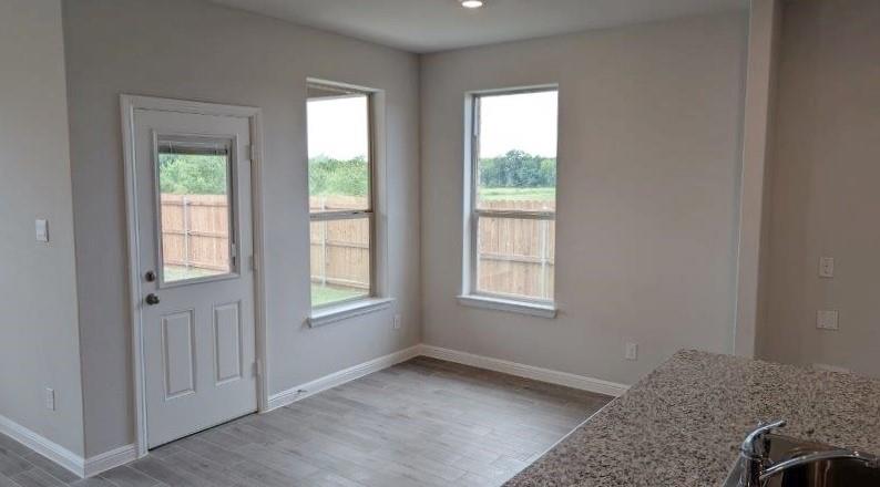 956 Traction Trail Cleburne, TX 76031 - Photo 2 of 15 an empty room with windows