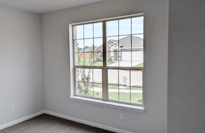 956 Traction Trail Cleburne, TX 76031 - Photo 7 of 15 an empty room with a window