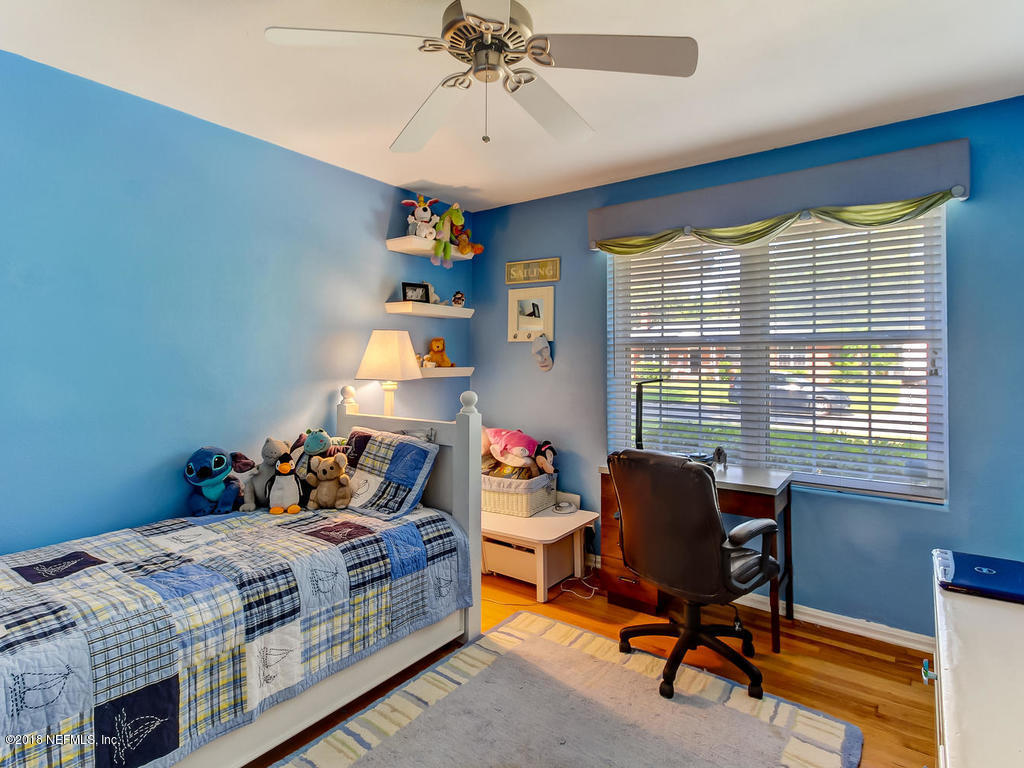 1526 Somerville Road Jacksonville, FL 32207 - Photo 16 of 30 a bedroom with a bed and a window
