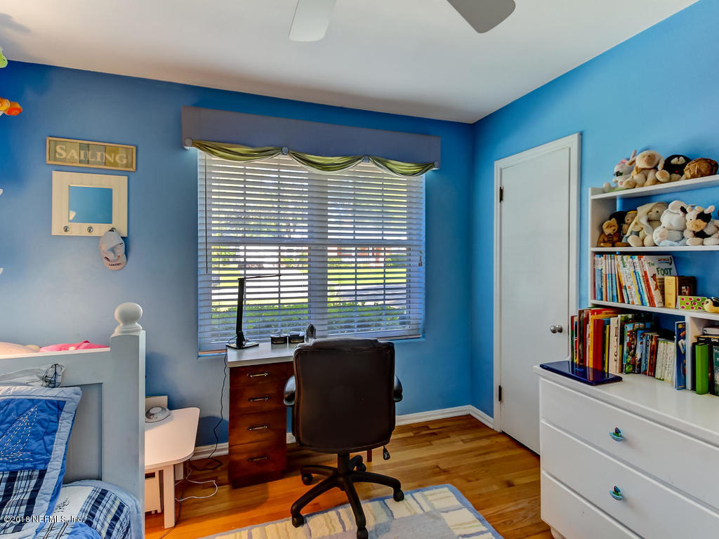 1526 Somerville Road Jacksonville, FL 32207 - Photo 17 of 30 a view of a workspace with furniture and a window