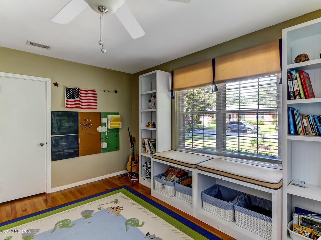 1526 Somerville Road Jacksonville, FL 32207 - Photo 19 of 30 a room with furniture and a book shelf