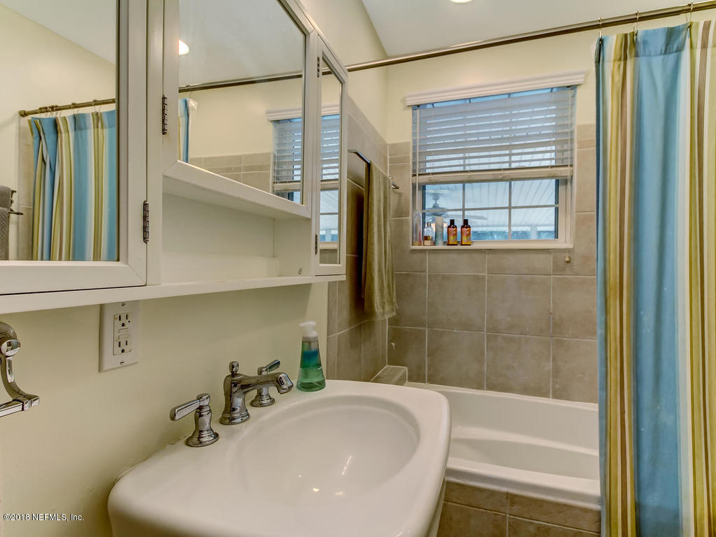 1526 Somerville Road Jacksonville, FL 32207 - Photo 24 of 30 a bathroom with a bathtub and shower