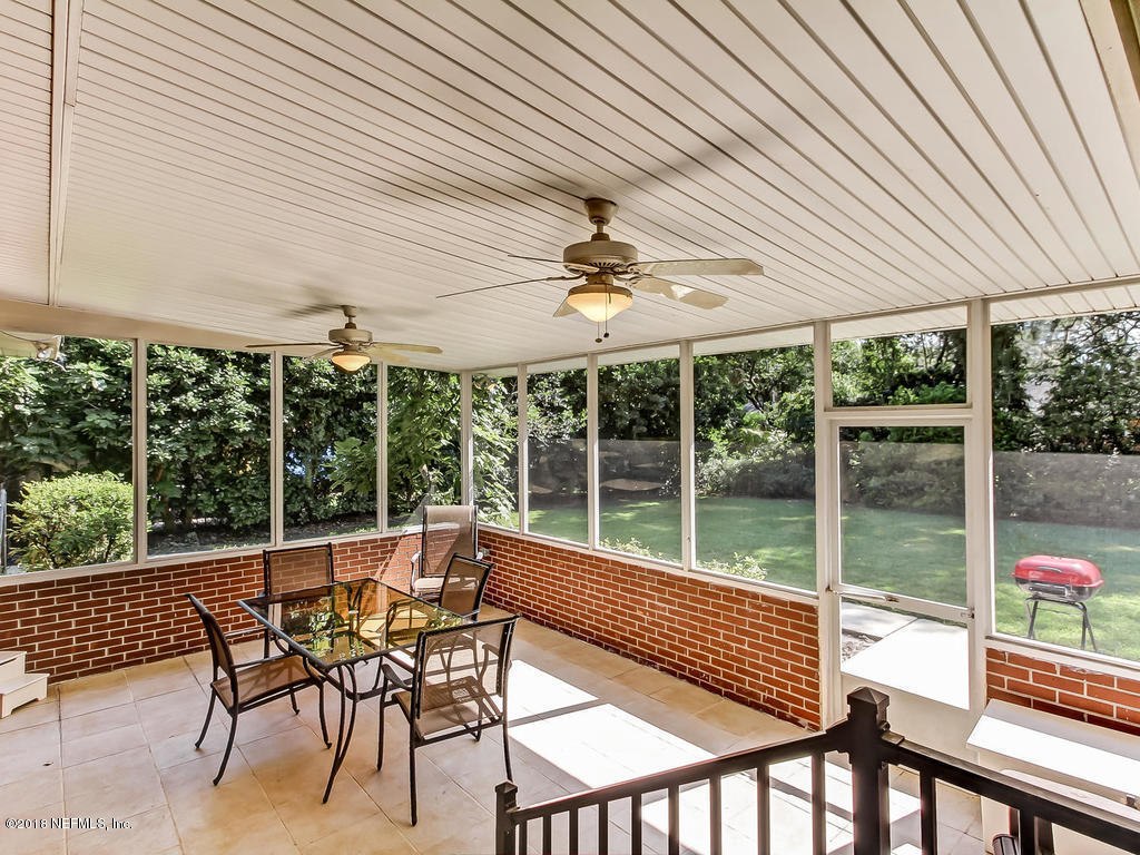 1526 Somerville Road Jacksonville, FL 32207 - Photo 25 of 30 a view of a patio with a table and chairs