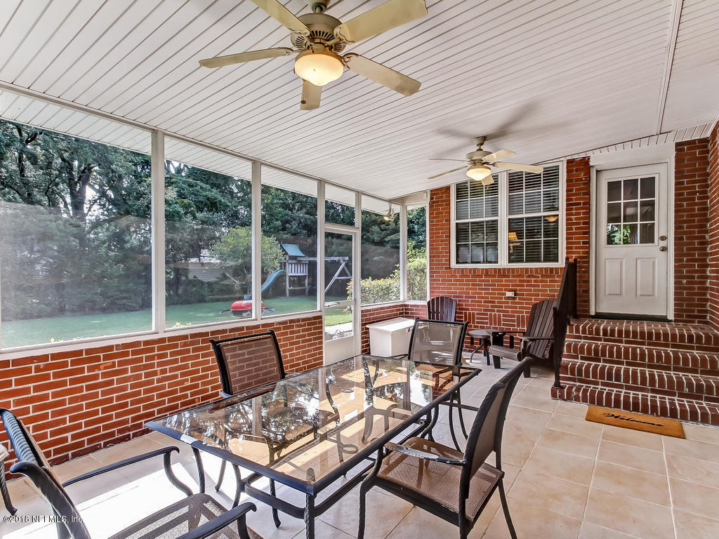 1526 Somerville Road Jacksonville, FL 32207 - Photo 26 of 30 a view of a patio with a dining table and chairs