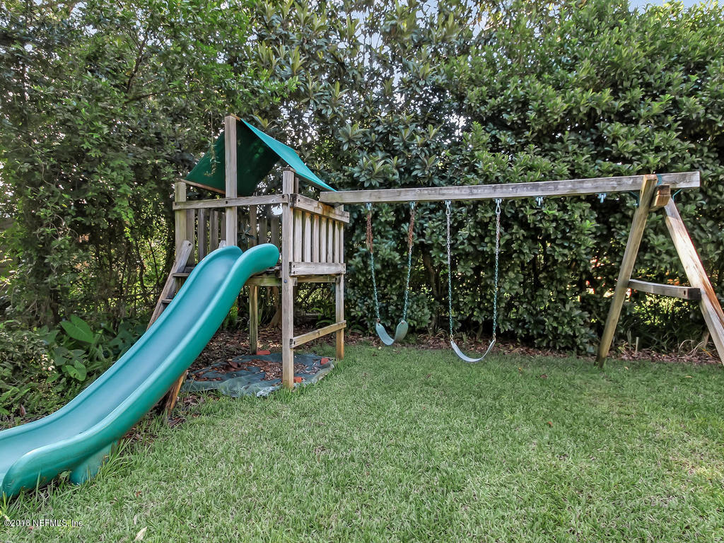 1526 Somerville Road Jacksonville, FL 32207 - Photo 30 of 30 a view of a wooden deck with a bench and wooden fence