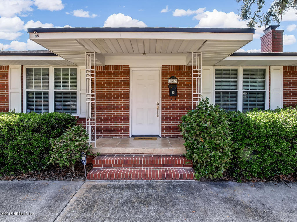 1526 Somerville Road Jacksonville, FL 32207 - Photo 5 of 30 a front view of a house with a garden