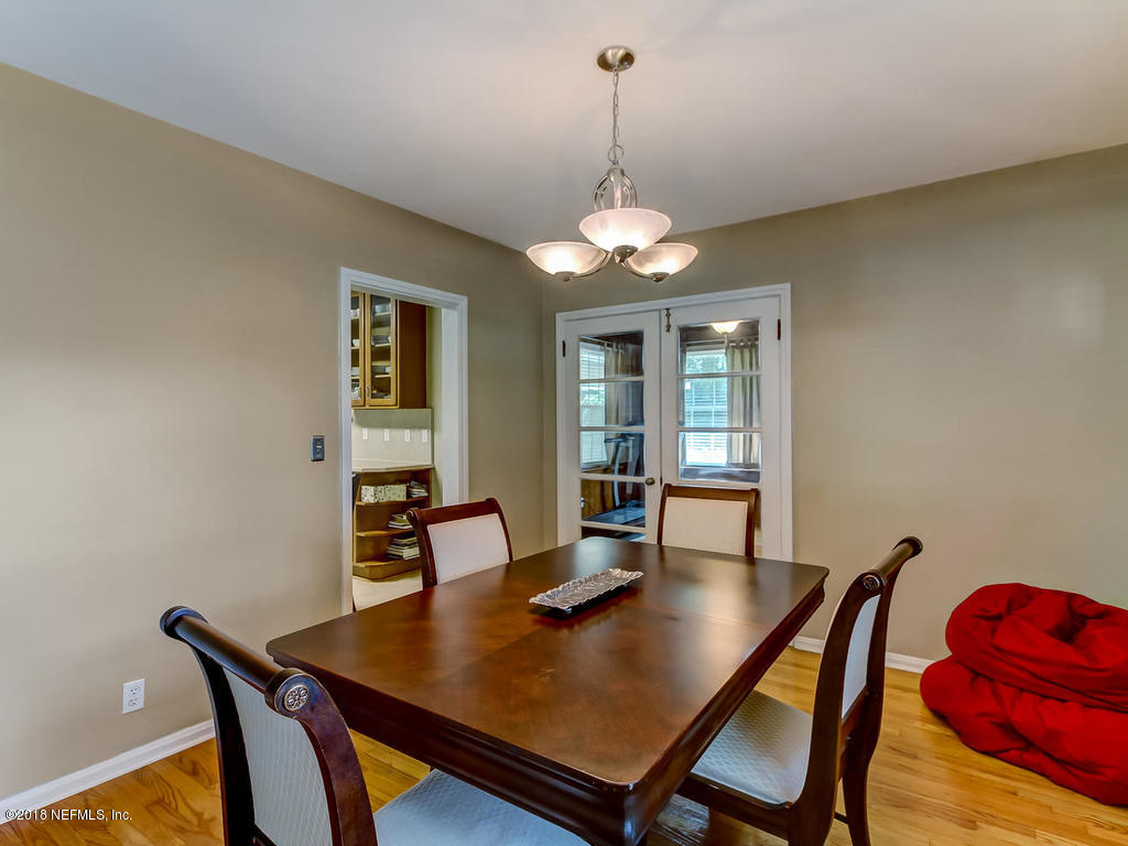1526 Somerville Road Jacksonville, FL 32207 - Photo 9 of 30 a view of a dining room with a table and chairs