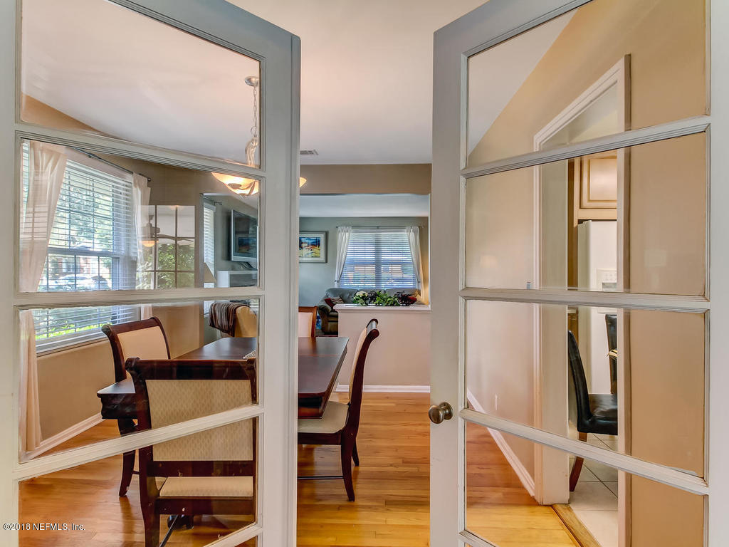 1526 Somerville Road Jacksonville, FL 32207 - Photo 10 of 30 a view of a dining room with furniture and wooden floor