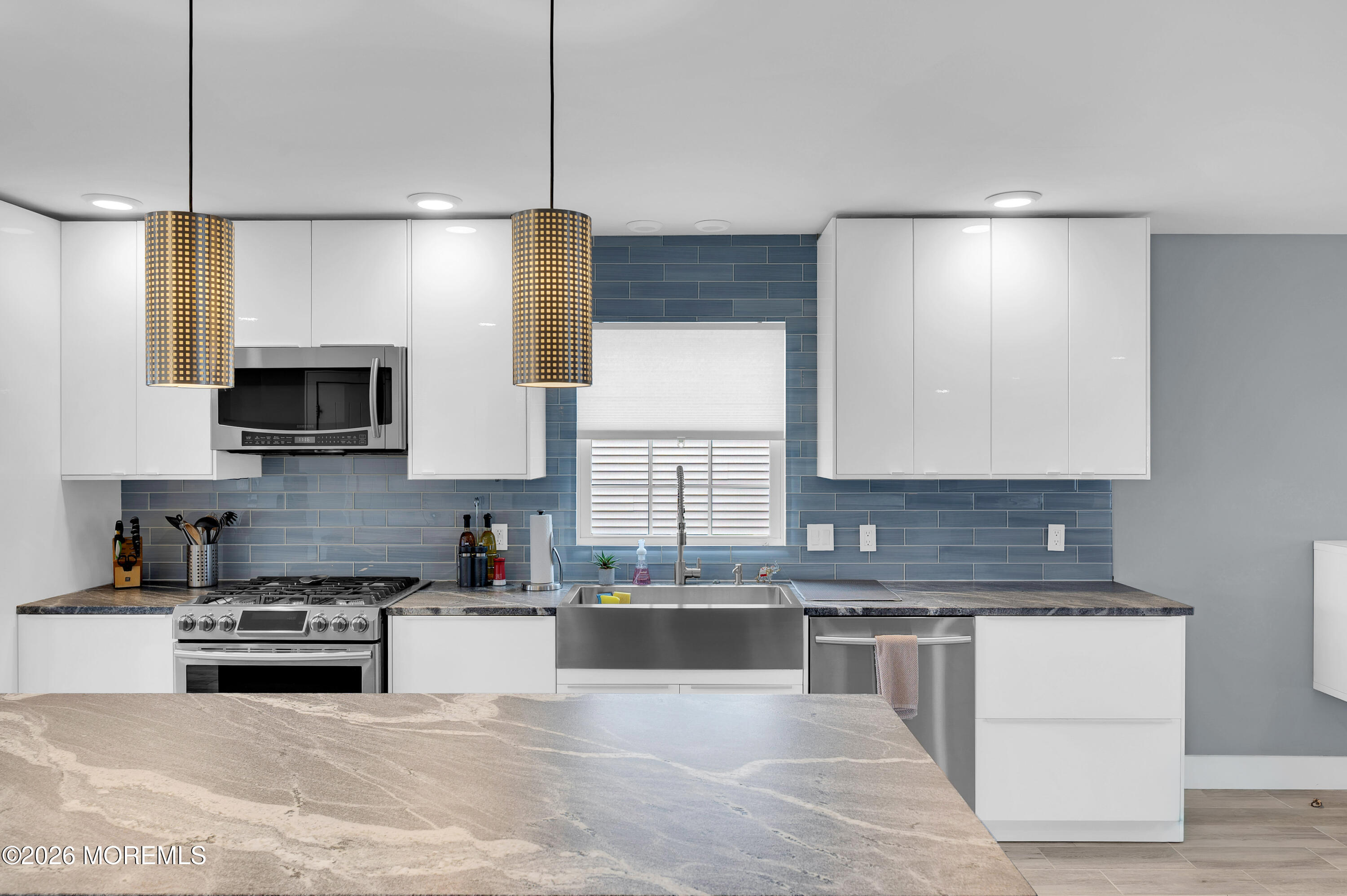 97 Bay View Drive Brick, NJ 08723 - Photo 13 of 65 a kitchen with stainless steel appliances granite countertop a stove a sink and a microwave