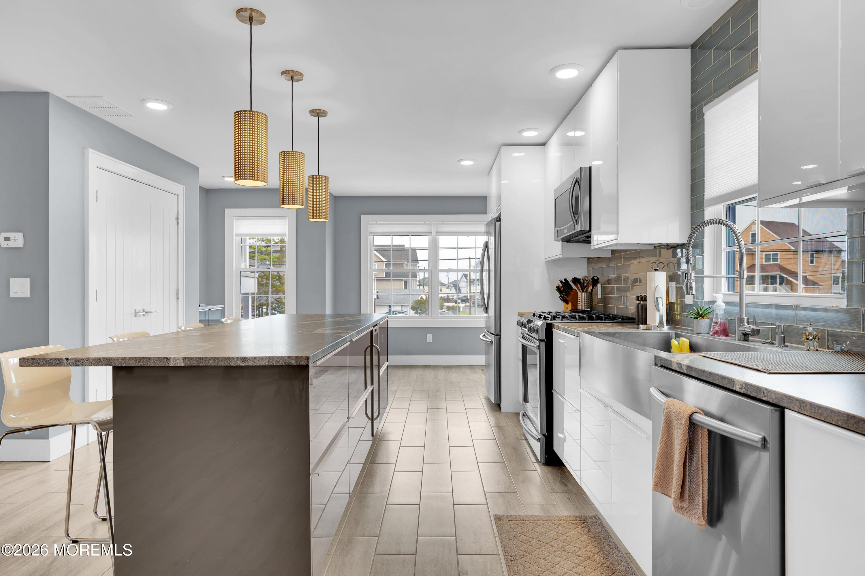 97 Bay View Drive Brick, NJ 08723 - Photo 17 of 65 a kitchen with stainless steel appliances granite countertop a sink a stove and refrigerator