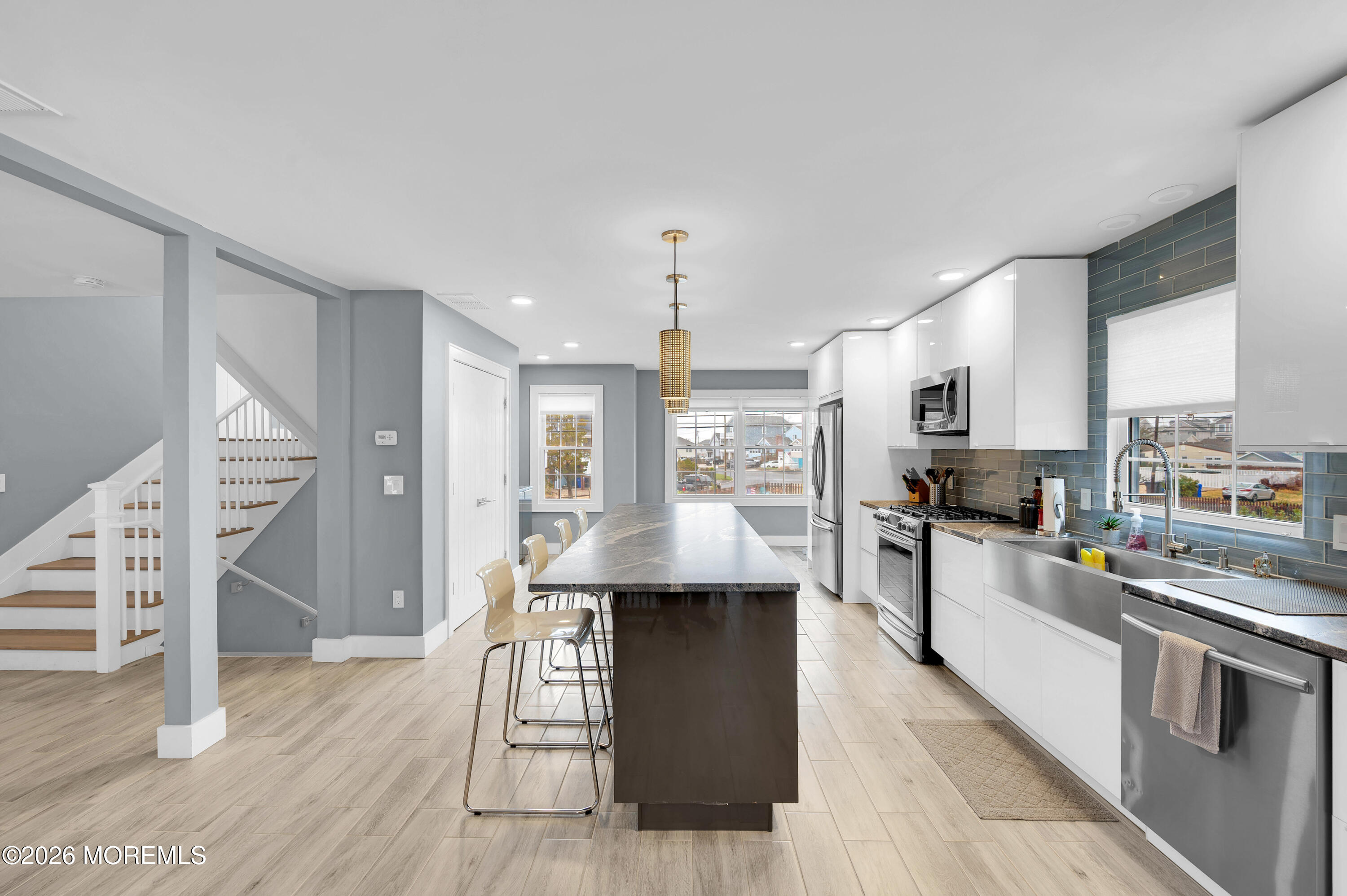 97 Bay View Drive Brick, NJ 08723 - Photo 18 of 65 a kitchen with stainless steel appliances kitchen island granite countertop a stove a sink and a refrigerator