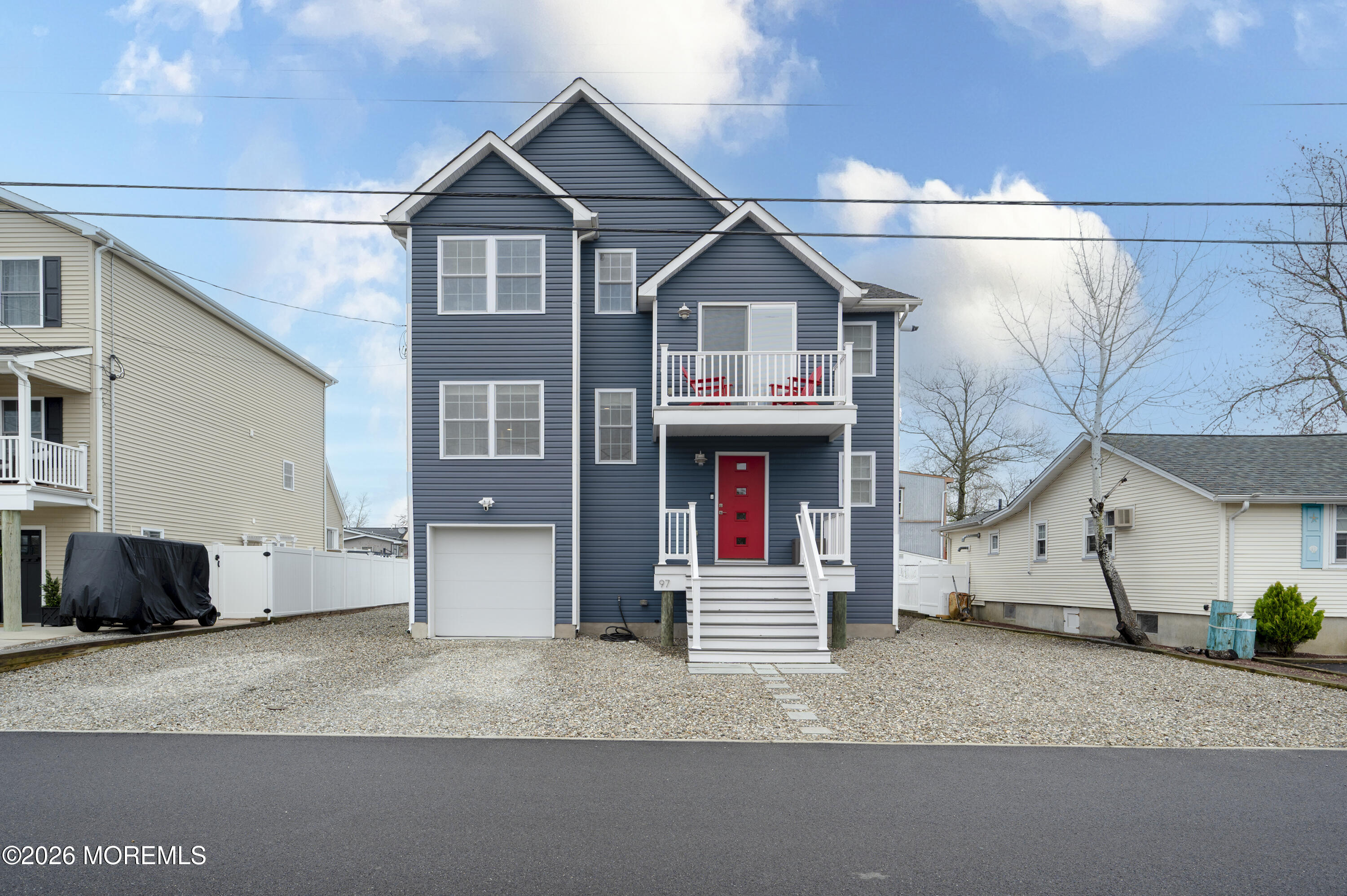 97 Bay View Drive Brick, NJ 08723 - Photo 2 of 65 a front view of a house with a yard and garage