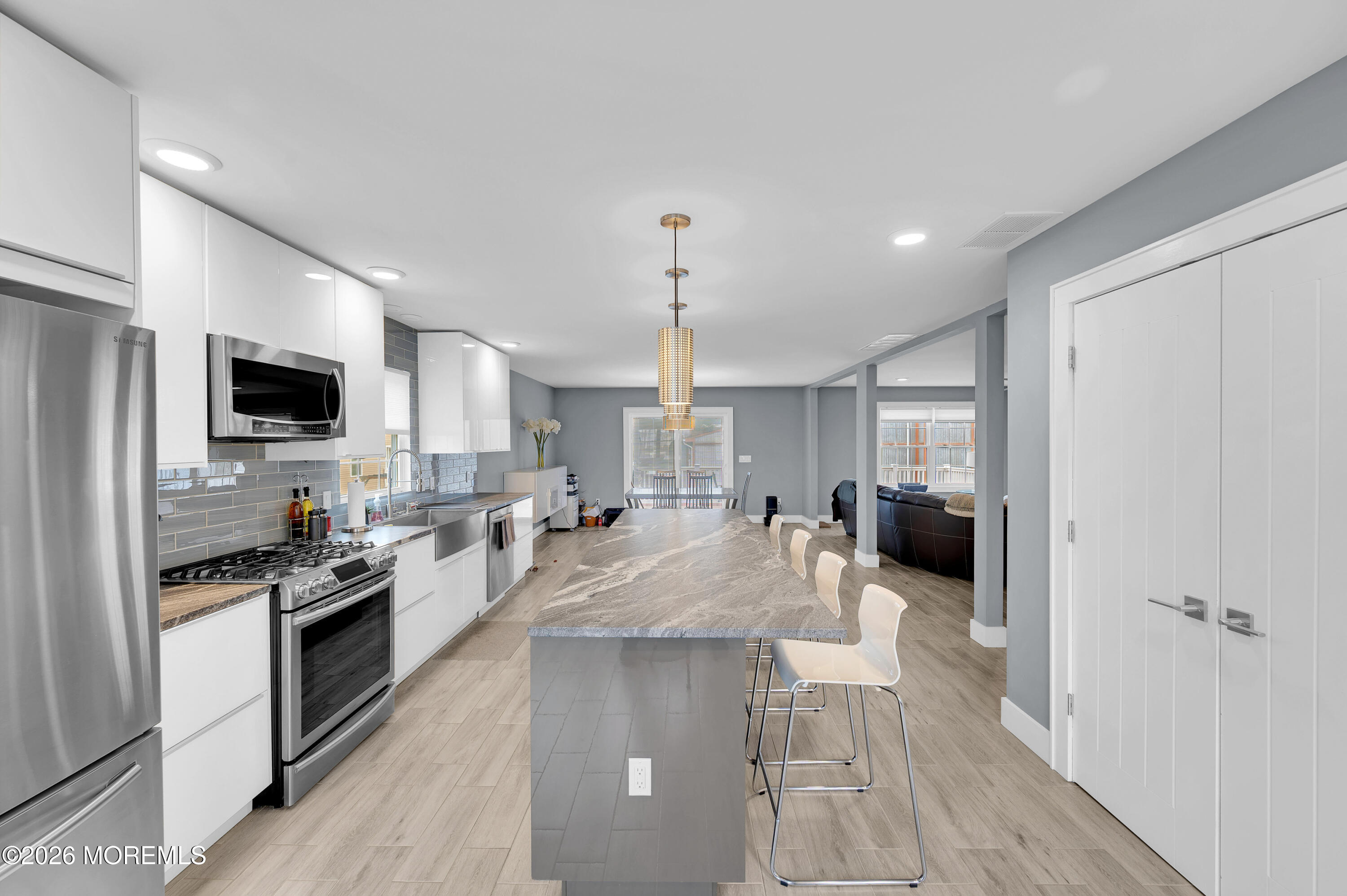 97 Bay View Drive Brick, NJ 08723 - Photo 21 of 65 a large kitchen with a large window and stainless steel appliances