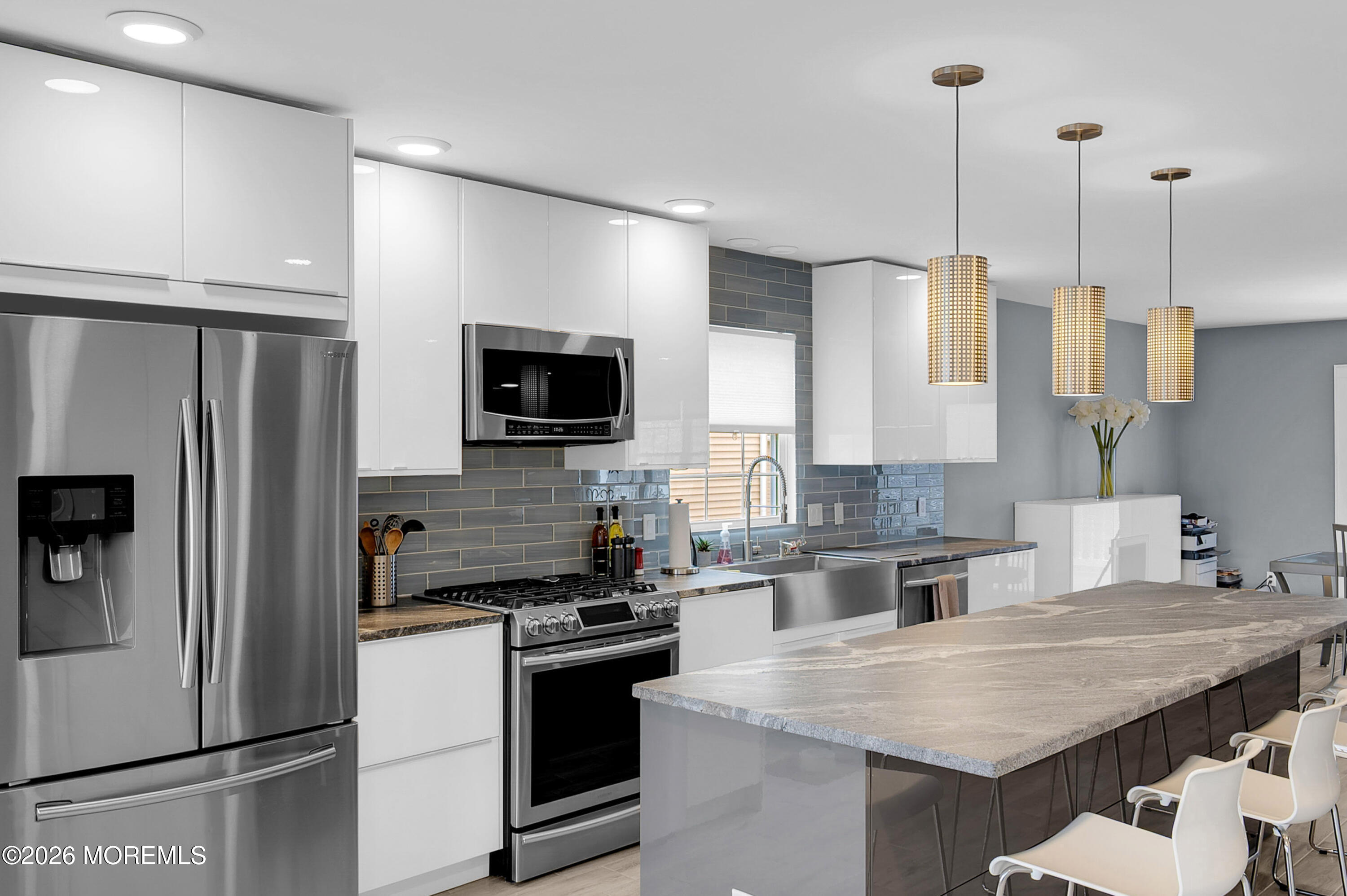 97 Bay View Drive Brick, NJ 08723 - Photo 24 of 65 a kitchen with a sink a counter top space stainless steel appliances and cabinets