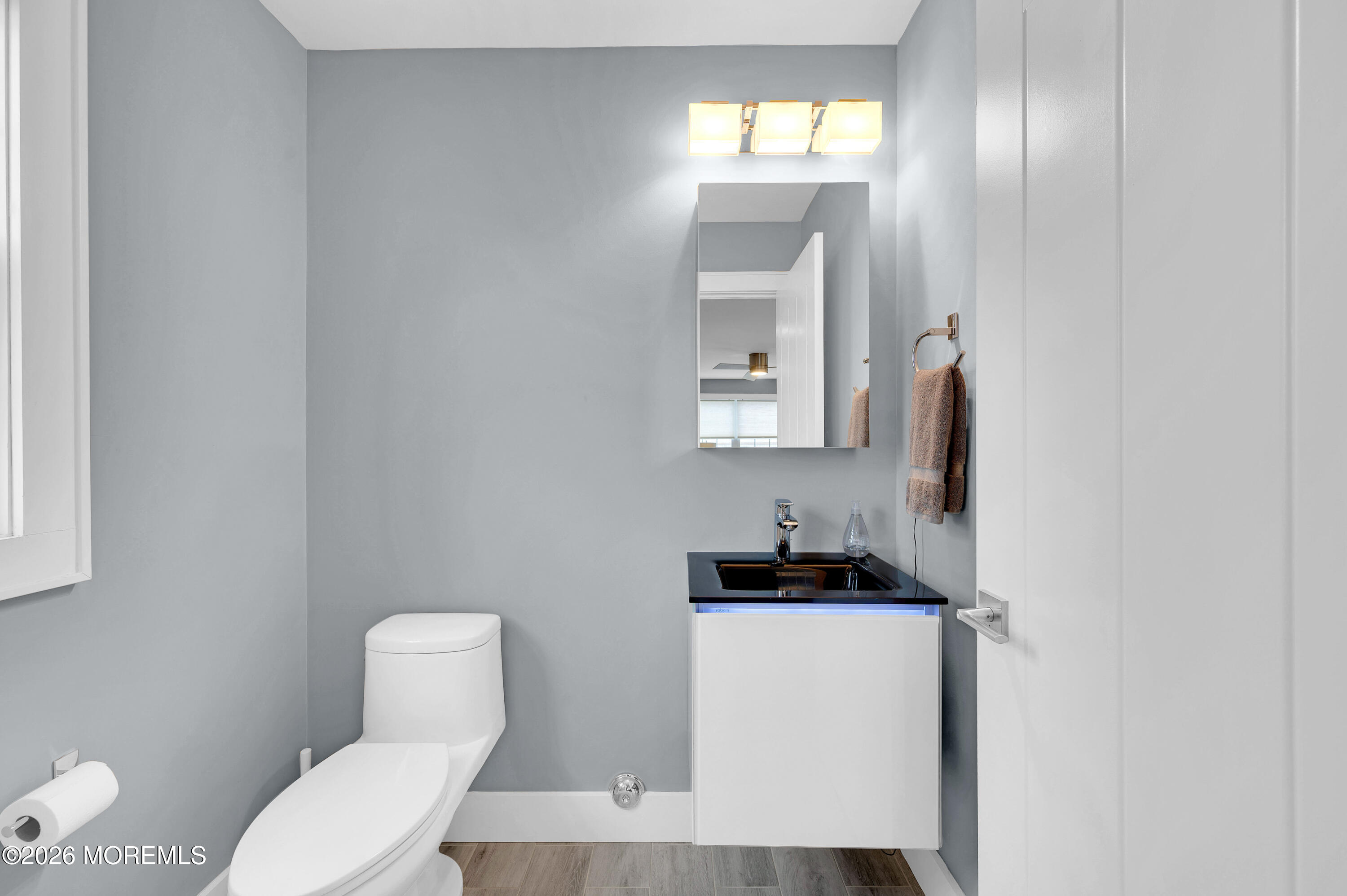 97 Bay View Drive Brick, NJ 08723 - Photo 30 of 65 a bathroom with a toilet sink and mirror