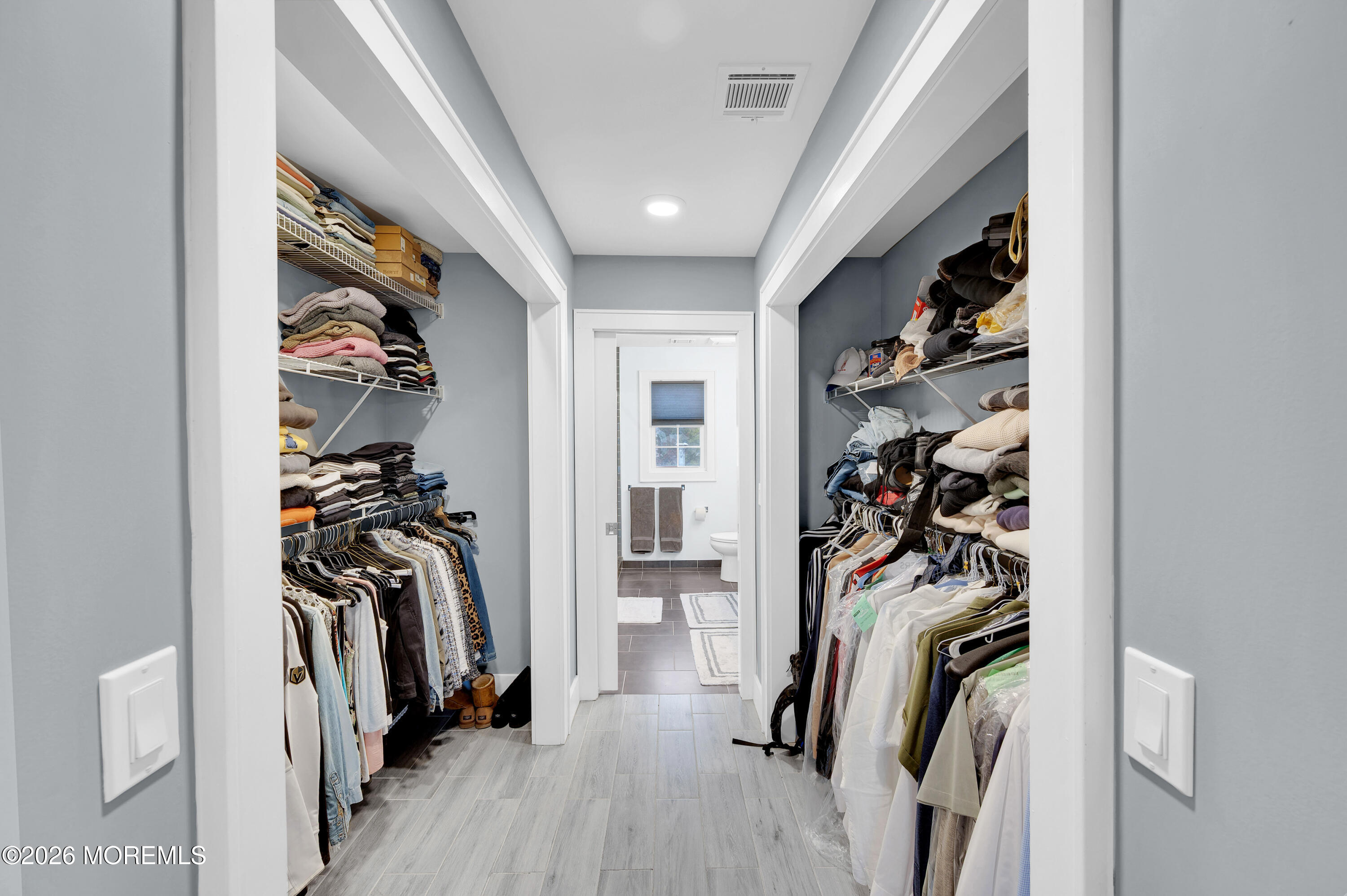 97 Bay View Drive Brick, NJ 08723 - Photo 36 of 65 a view of a walk in closet with clothes and shoes