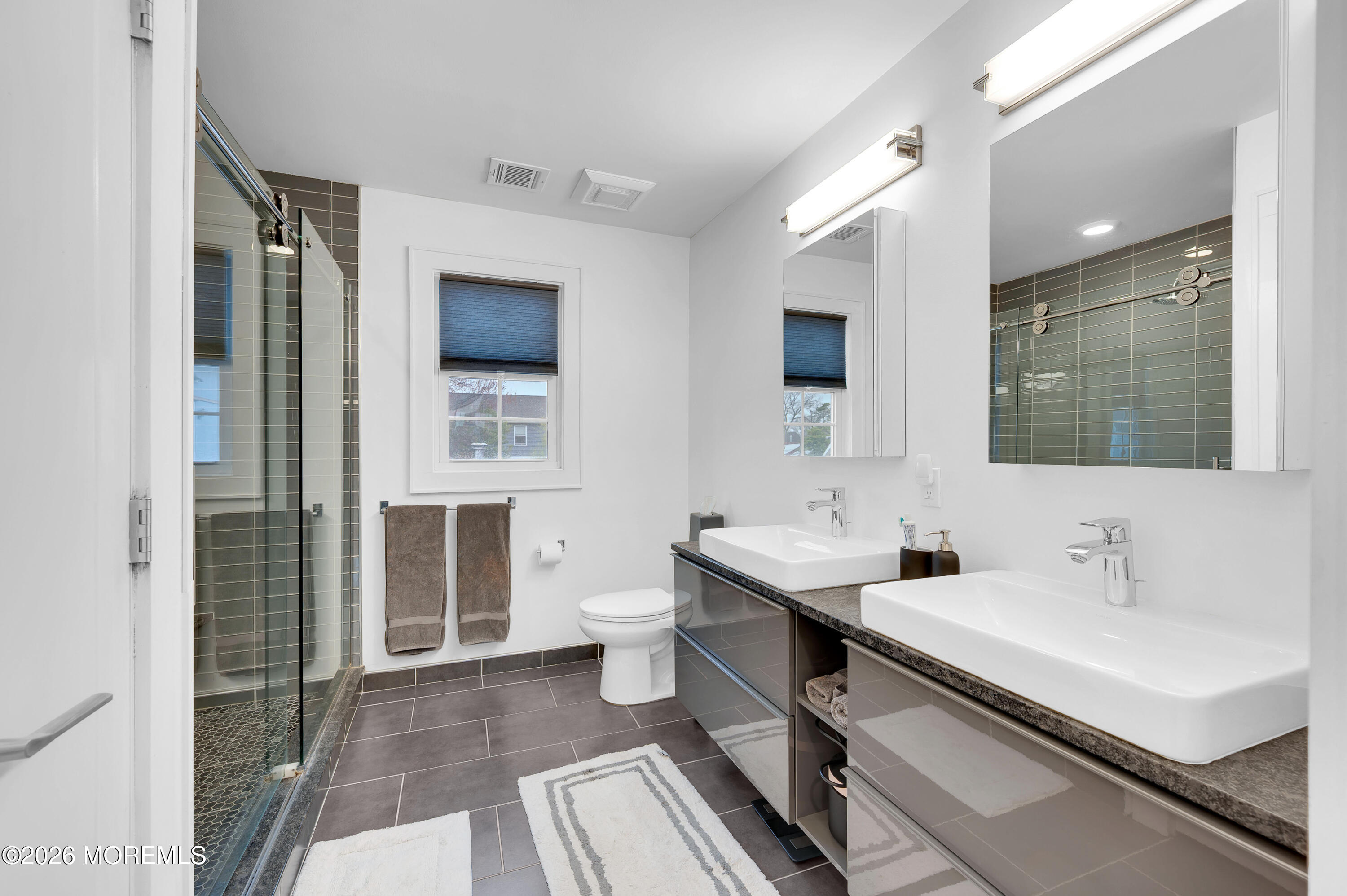 97 Bay View Drive Brick, NJ 08723 - Photo 37 of 65 a bathroom with a sink and a mirror