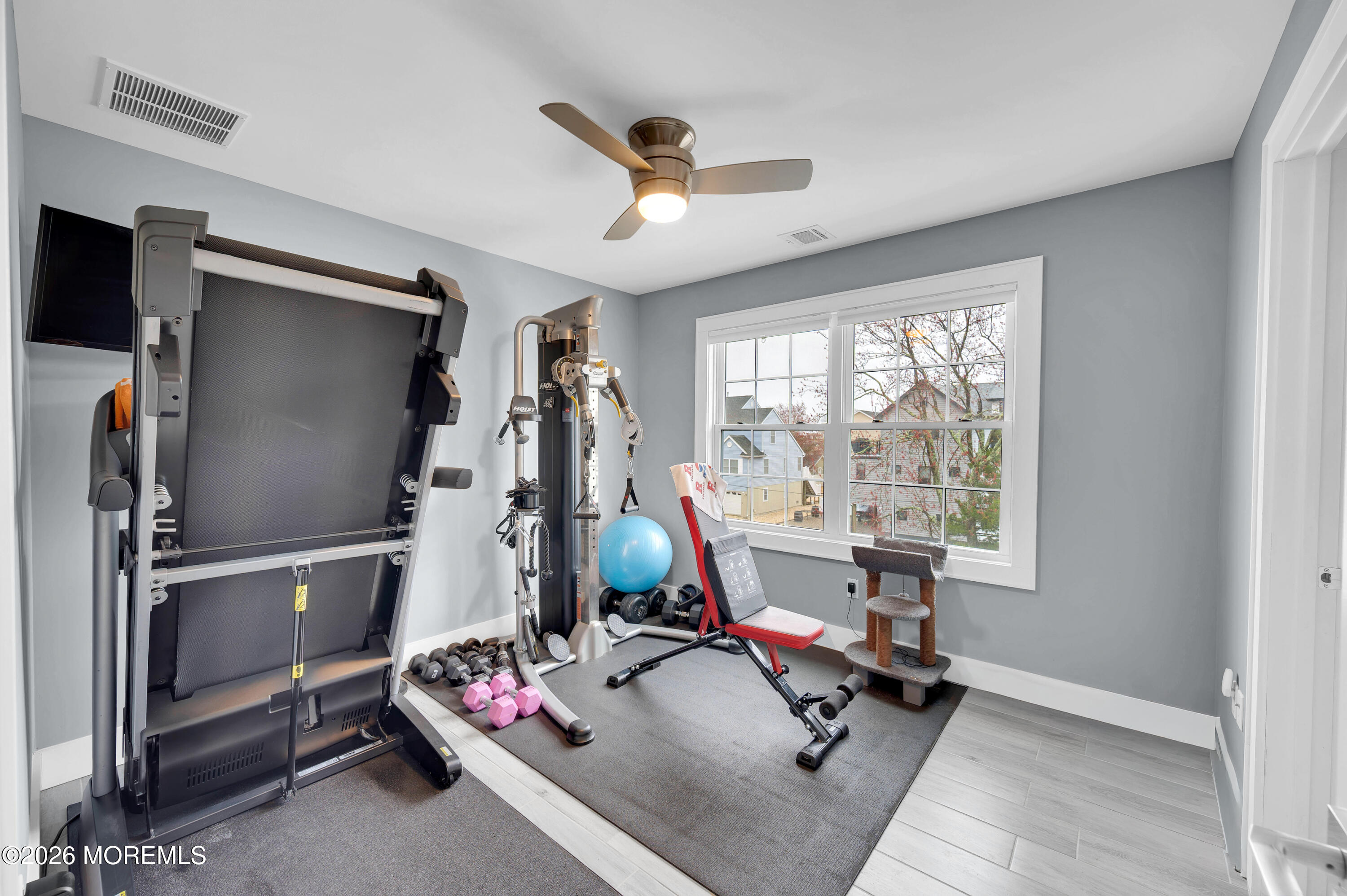97 Bay View Drive Brick, NJ 08723 - Photo 40 of 65 a room with gym equipment and a window