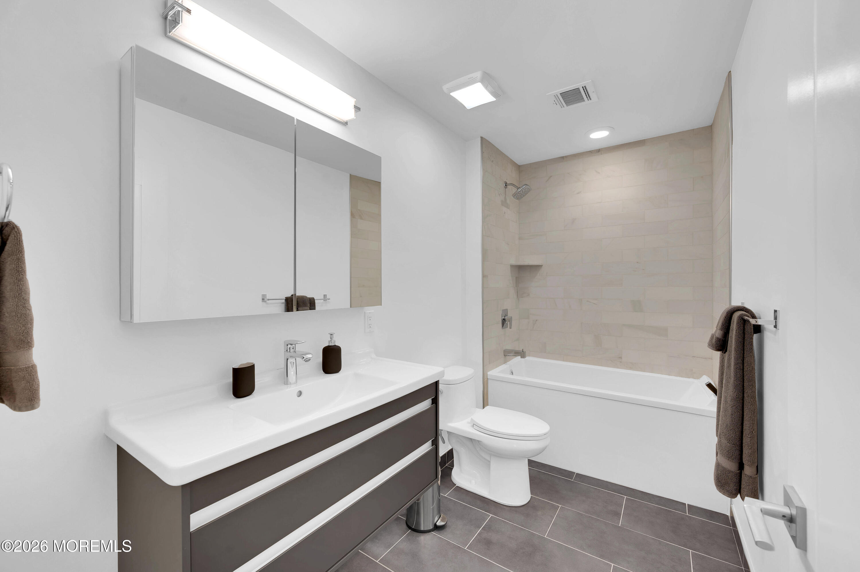 97 Bay View Drive Brick, NJ 08723 - Photo 41 of 65 a bathroom with a sink a toilet and a bathtub