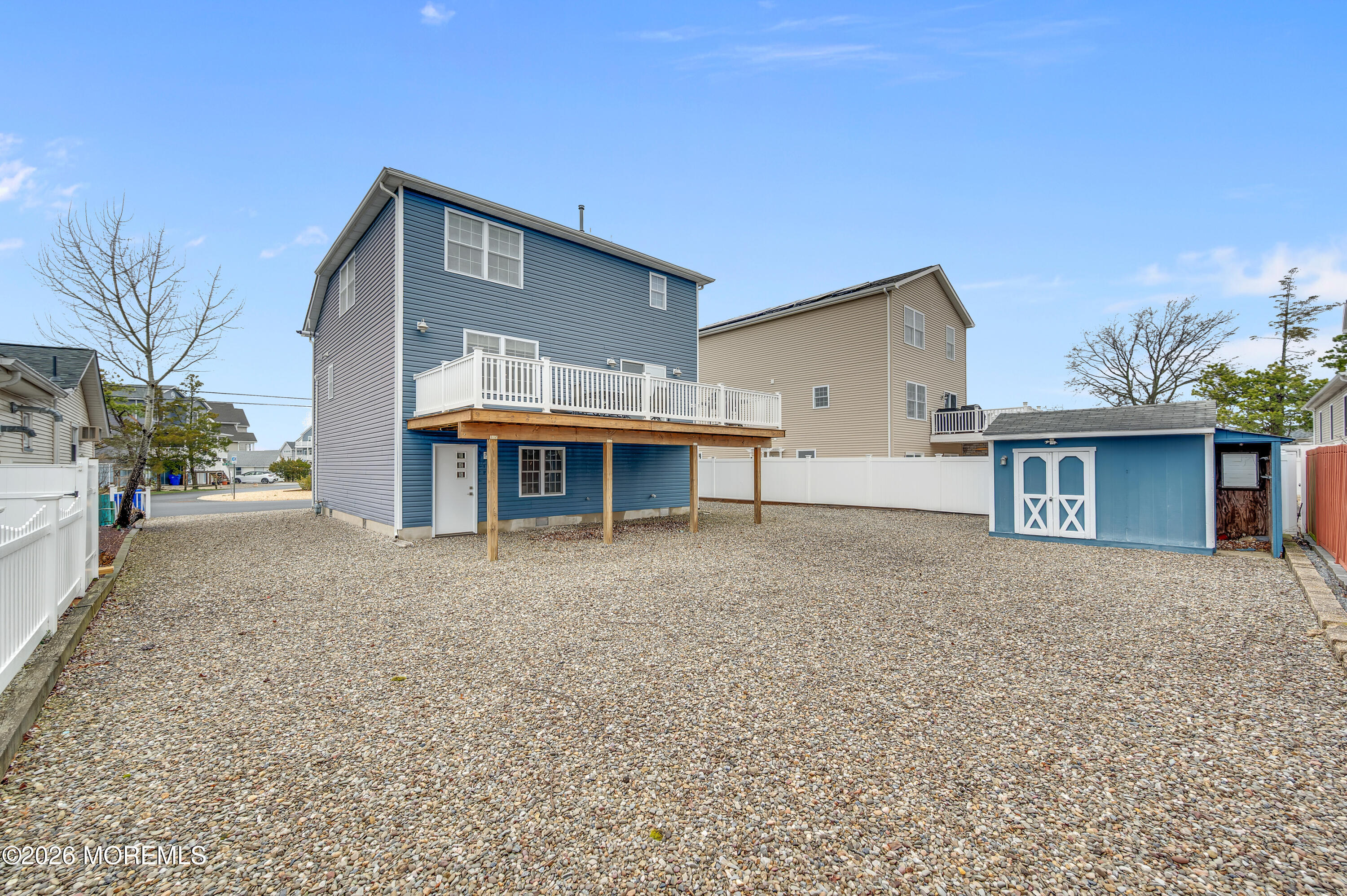 97 Bay View Drive Brick, NJ 08723 - Photo 47 of 65 a front view of a house with a yard and garage