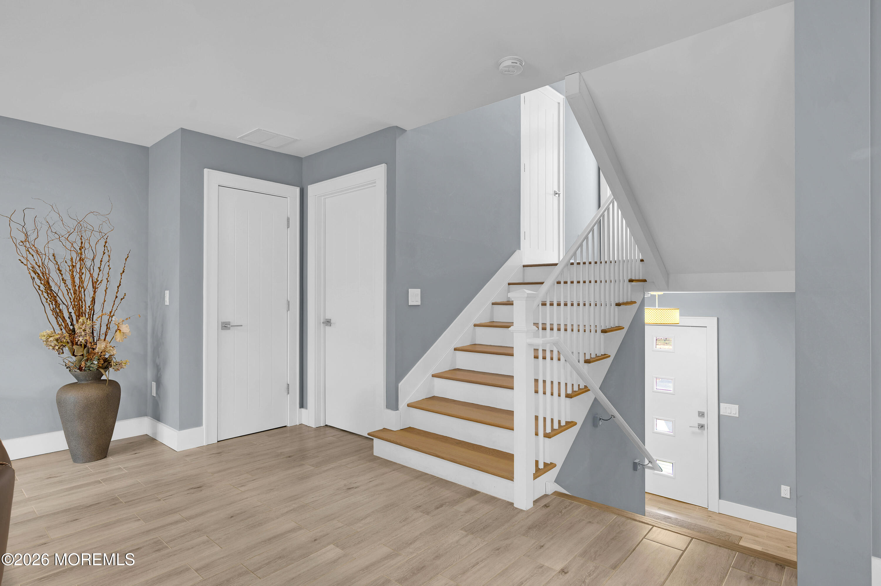 97 Bay View Drive Brick, NJ 08723 - Photo 7 of 65 a view of entryway and hall with wooden floor