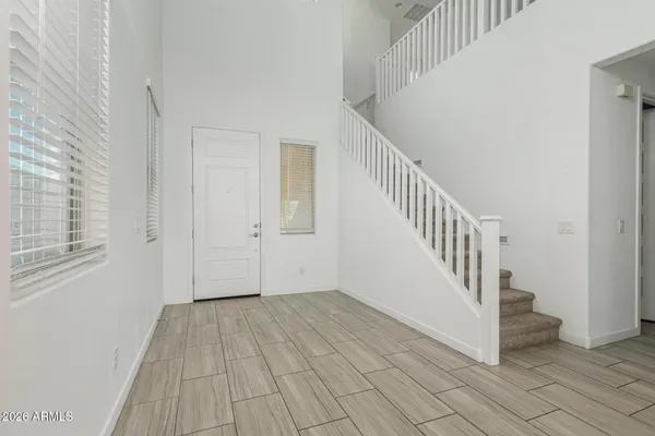 a view of entryway with wooden floor