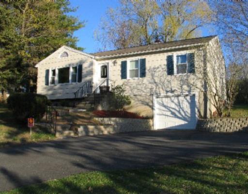 a front view of a house with yard