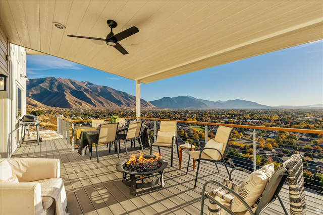 1800 Spring Oaks Drive Springville, UT 84663 - Photo 26 of 68 Deck with ceiling fan, a mountain view, a grill, and a fire pit