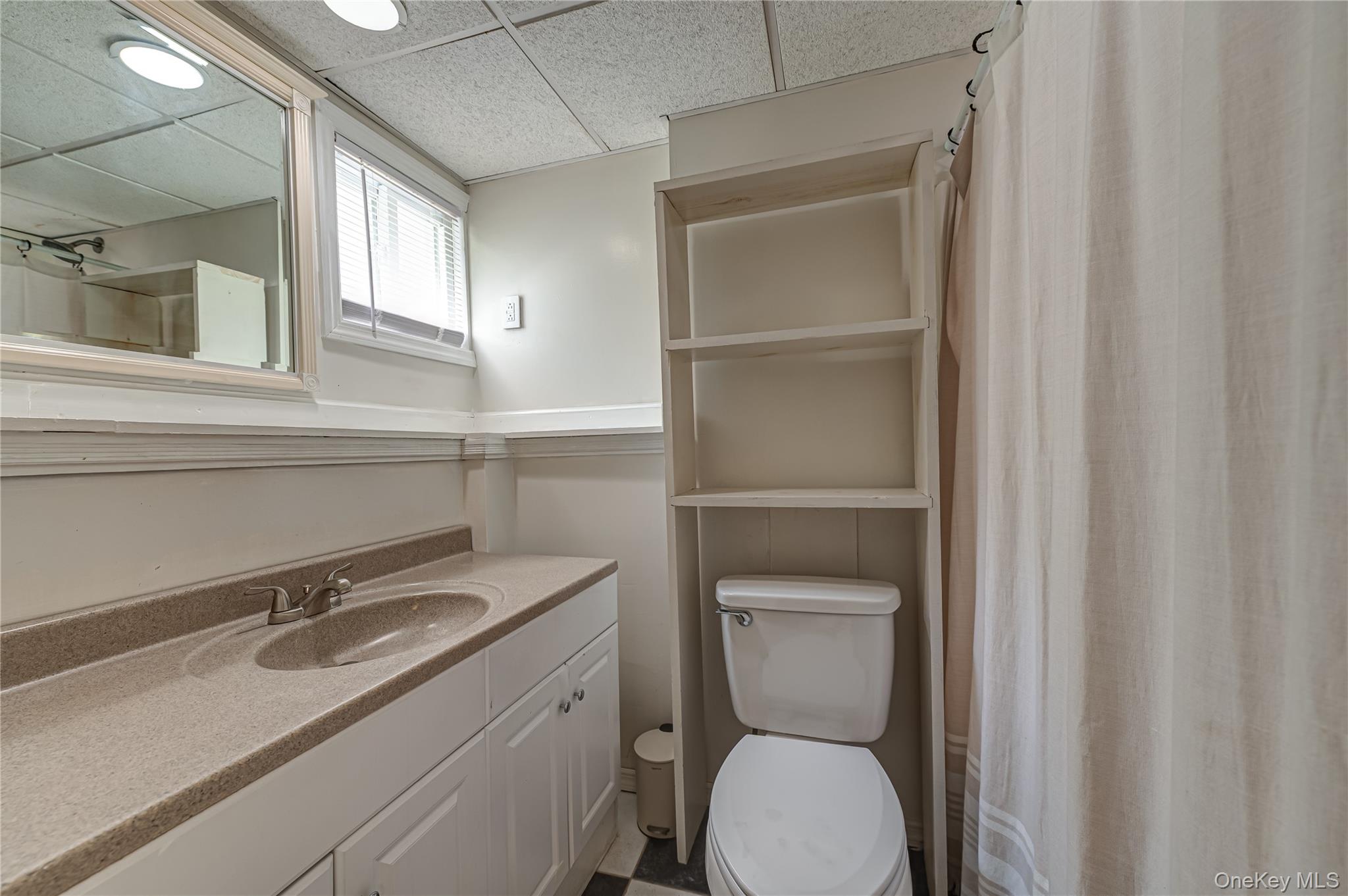 3 Thompson Hill Road St. James, NY 11780 - Photo 26 of 34 a bathroom with a toilet sink and mirror