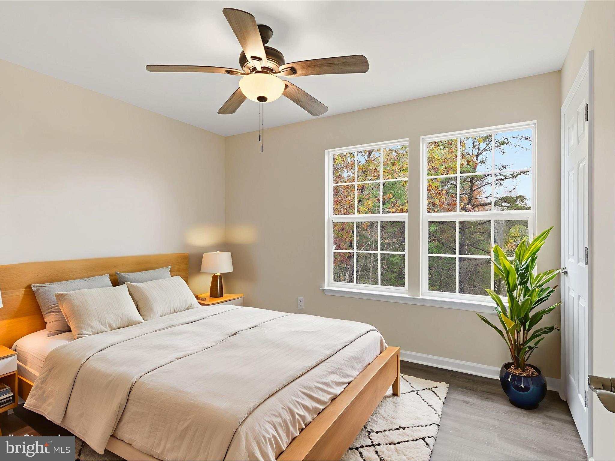 3281 Russel Run Road Locust Grove, VA 22508 - Photo 12 of 78 a bedroom with a bed and a large window with potted plants