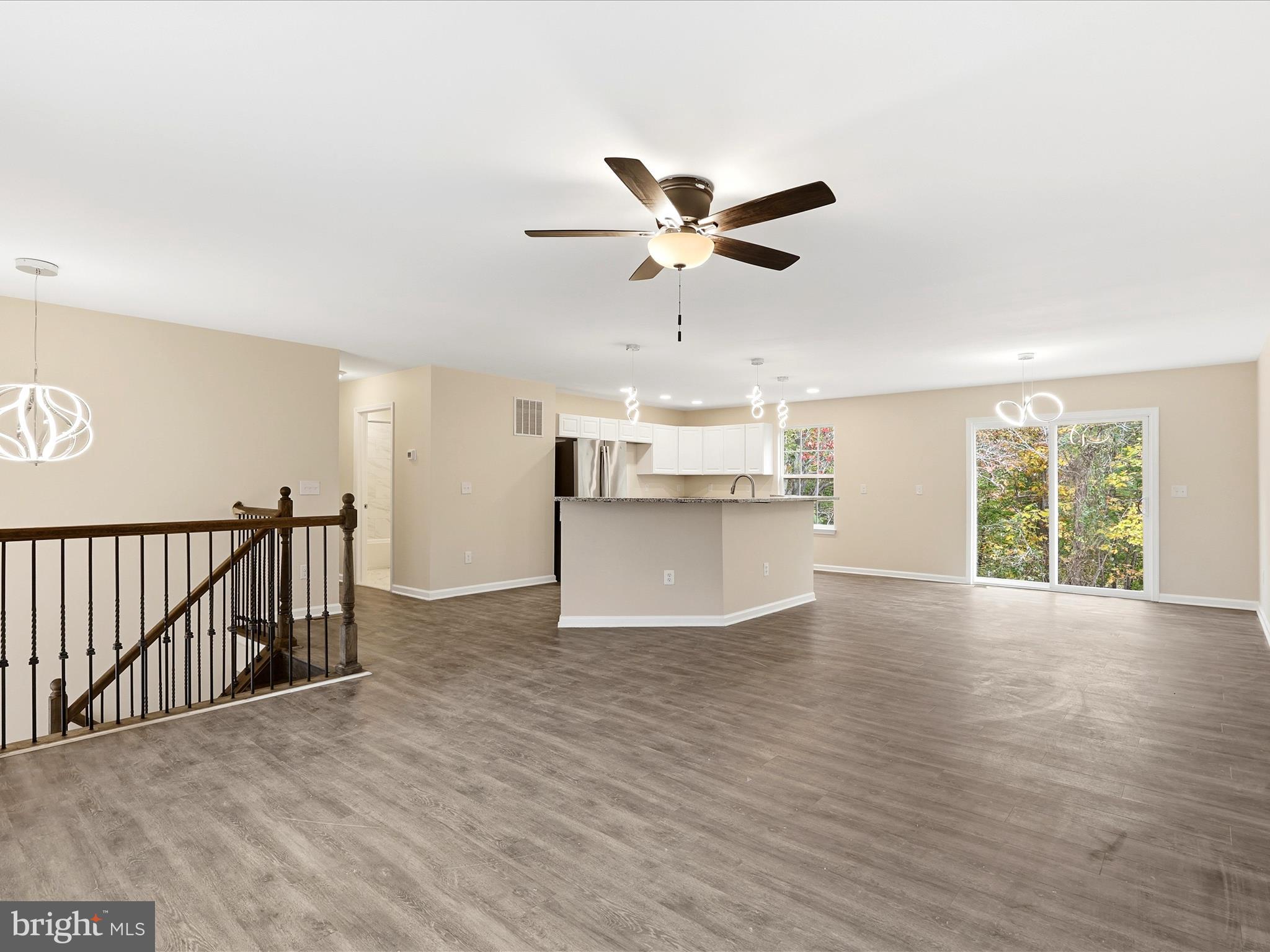 3281 Russel Run Road Locust Grove, VA 22508 - Photo 15 of 78 a view of a kitchen with wooden floor and a window