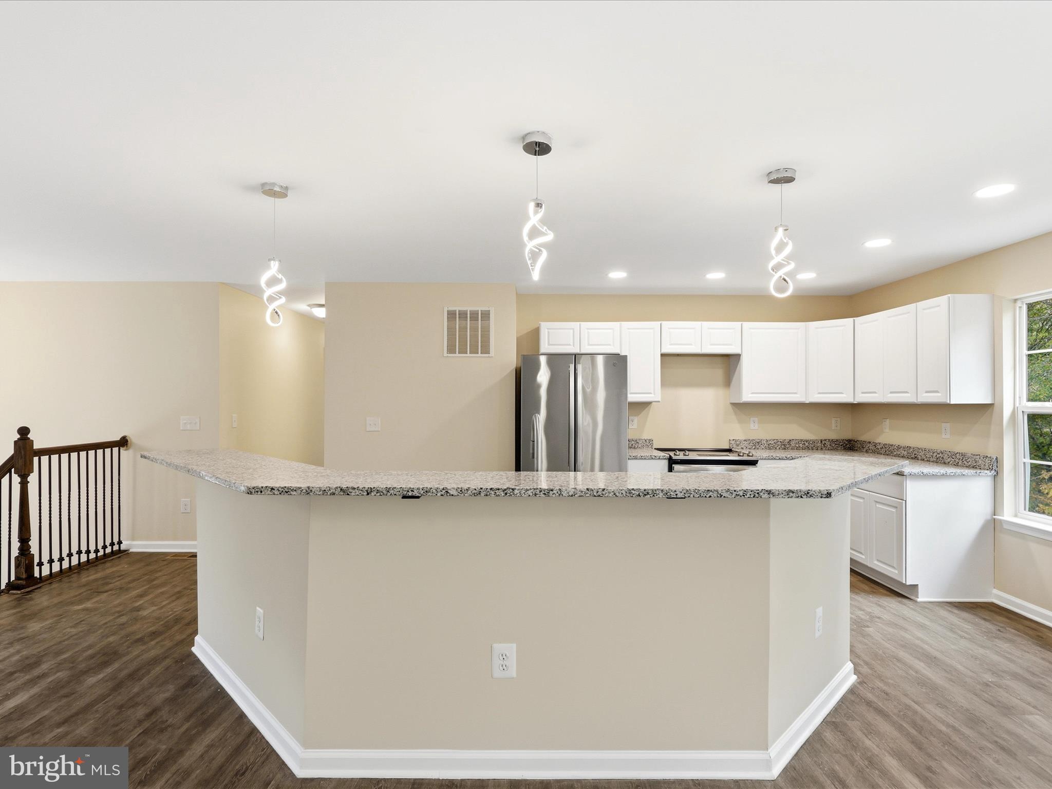 3281 Russel Run Road Locust Grove, VA 22508 - Photo 20 of 78 a large kitchen with stainless steel appliances granite countertop a stove a sink and a refrigerator
