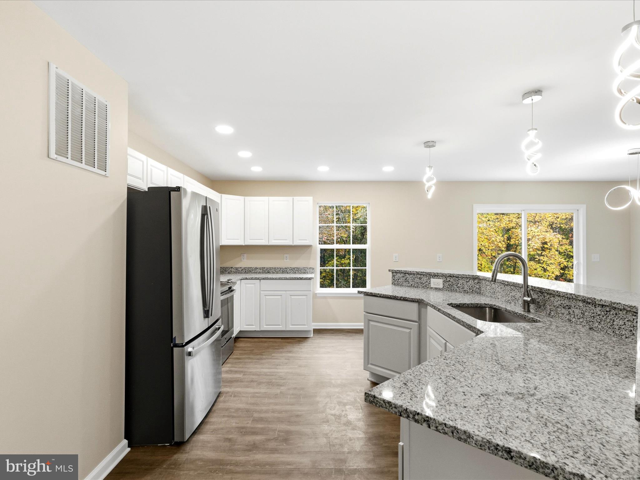 3281 Russel Run Road Locust Grove, VA 22508 - Photo 21 of 78 a kitchen with stainless steel appliances granite countertop a refrigerator and a sink