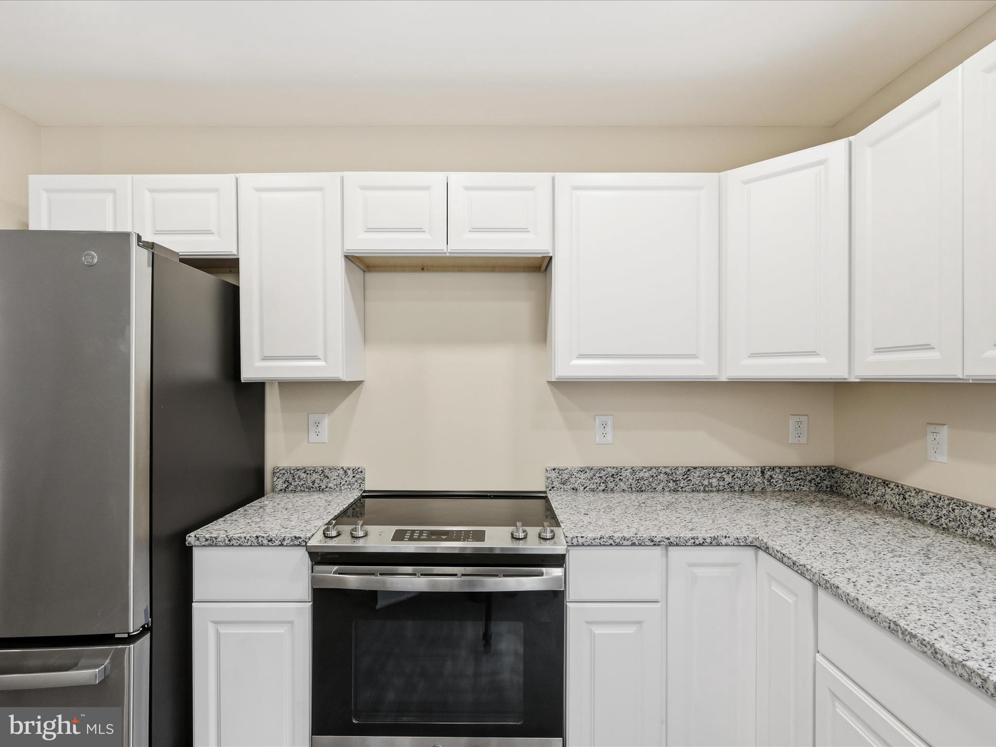 3281 Russel Run Road Locust Grove, VA 22508 - Photo 23 of 78 a kitchen with stainless steel appliances granite countertop a stove a refrigerator and a white cabinets