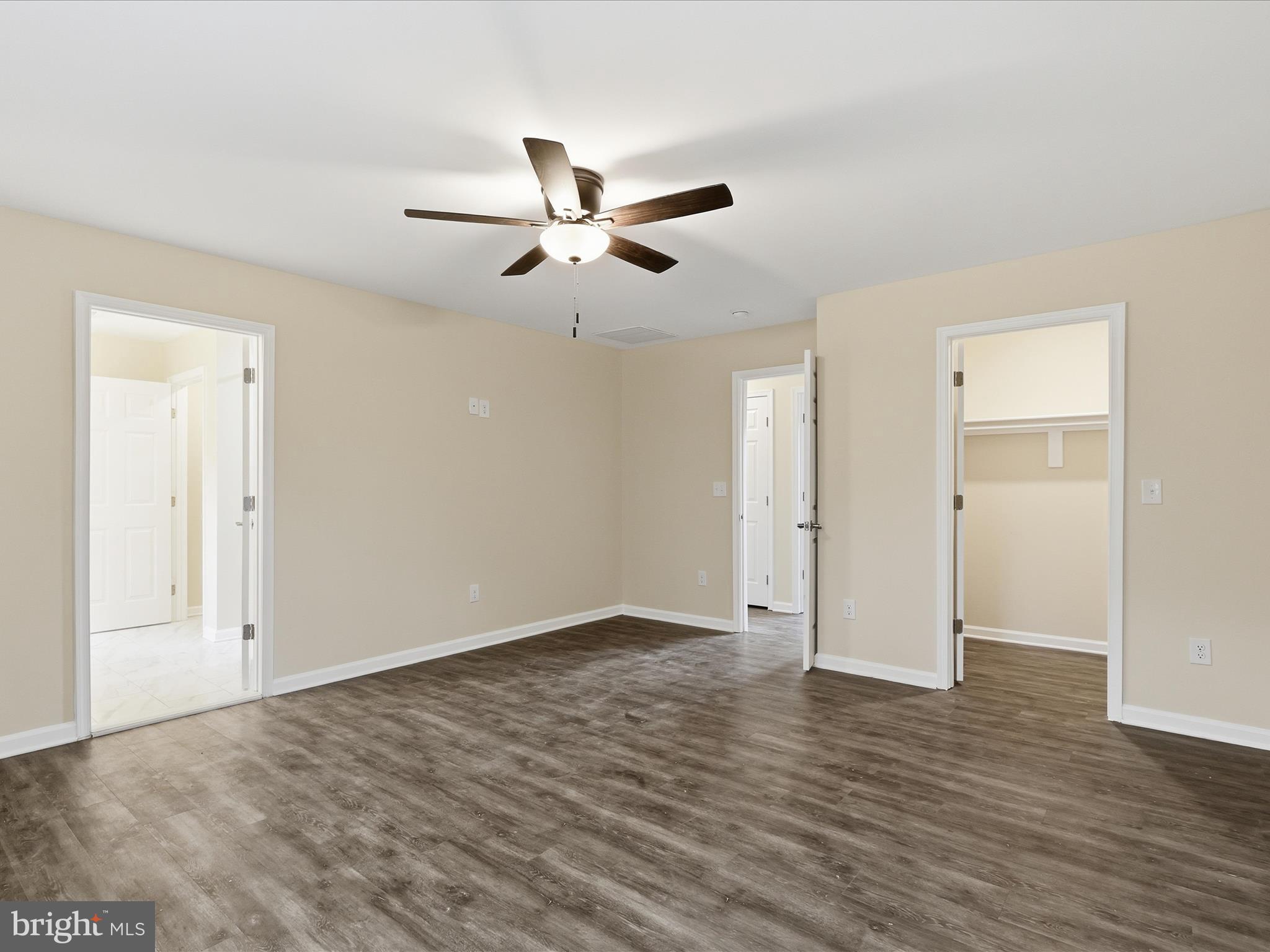 3281 Russel Run Road Locust Grove, VA 22508 - Photo 29 of 78 an empty room with wooden floor ceiling fan and windows