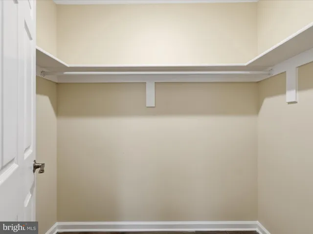 a bathroom with a toilet a sink a mirror a bathtub and vanity