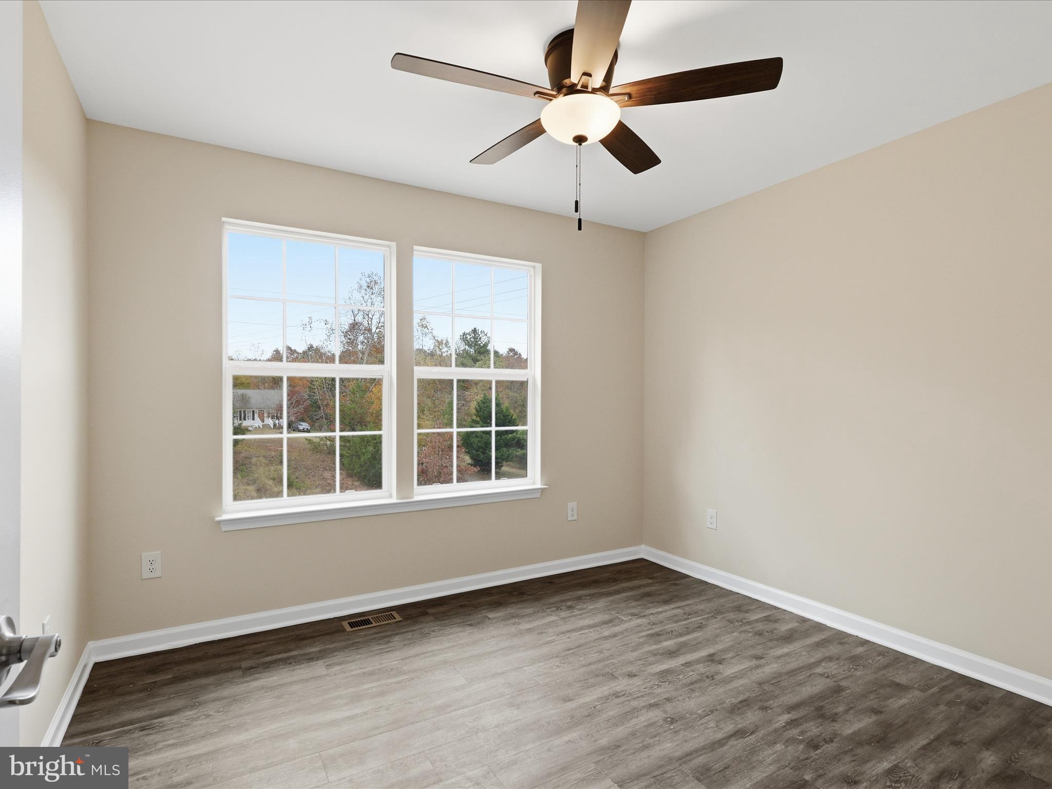 3281 Russel Run Road Locust Grove, VA 22508 - Photo 34 of 78 an empty room with wooden floor and windows