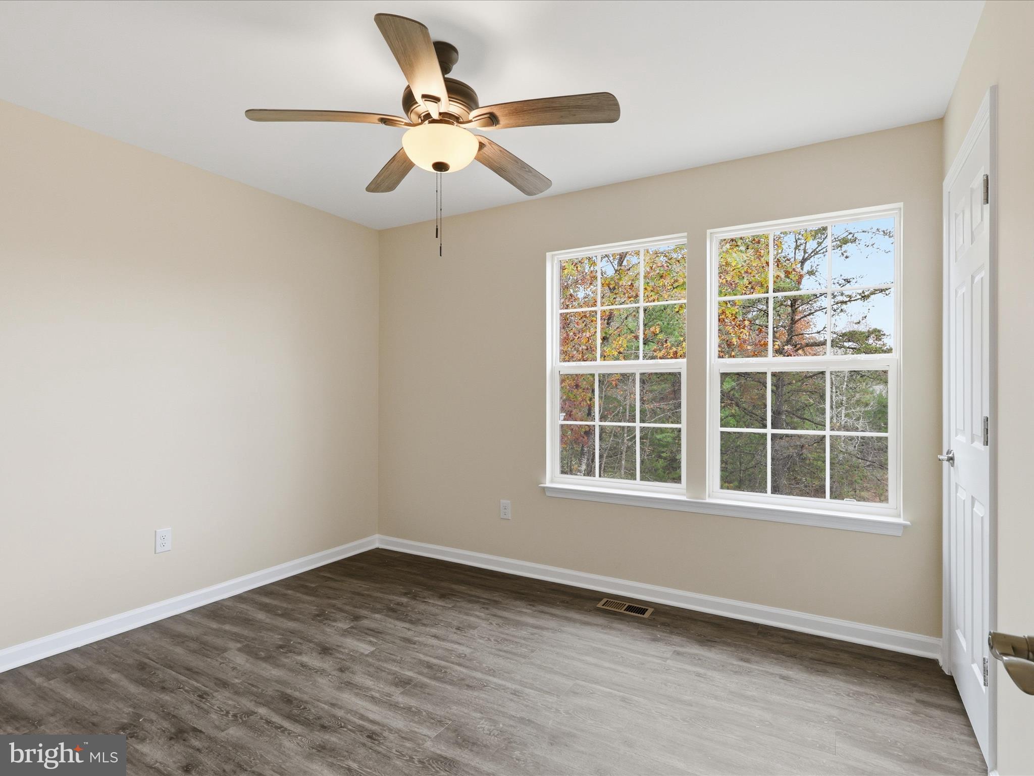 3281 Russel Run Road Locust Grove, VA 22508 - Photo 36 of 78 an empty room with wooden floor and windows